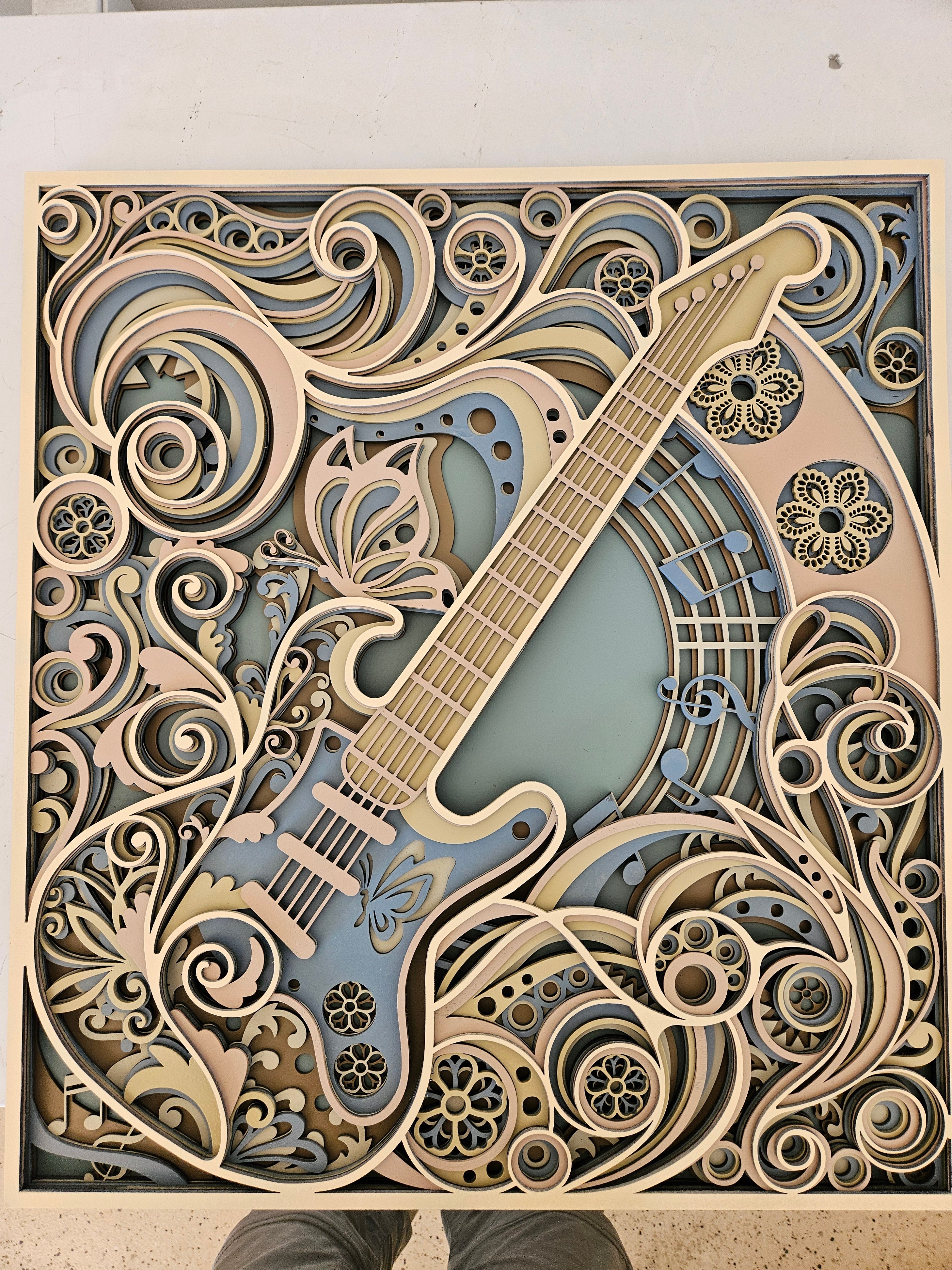 24 inch pastel laser-cut guitar wall art with floral and swirl details