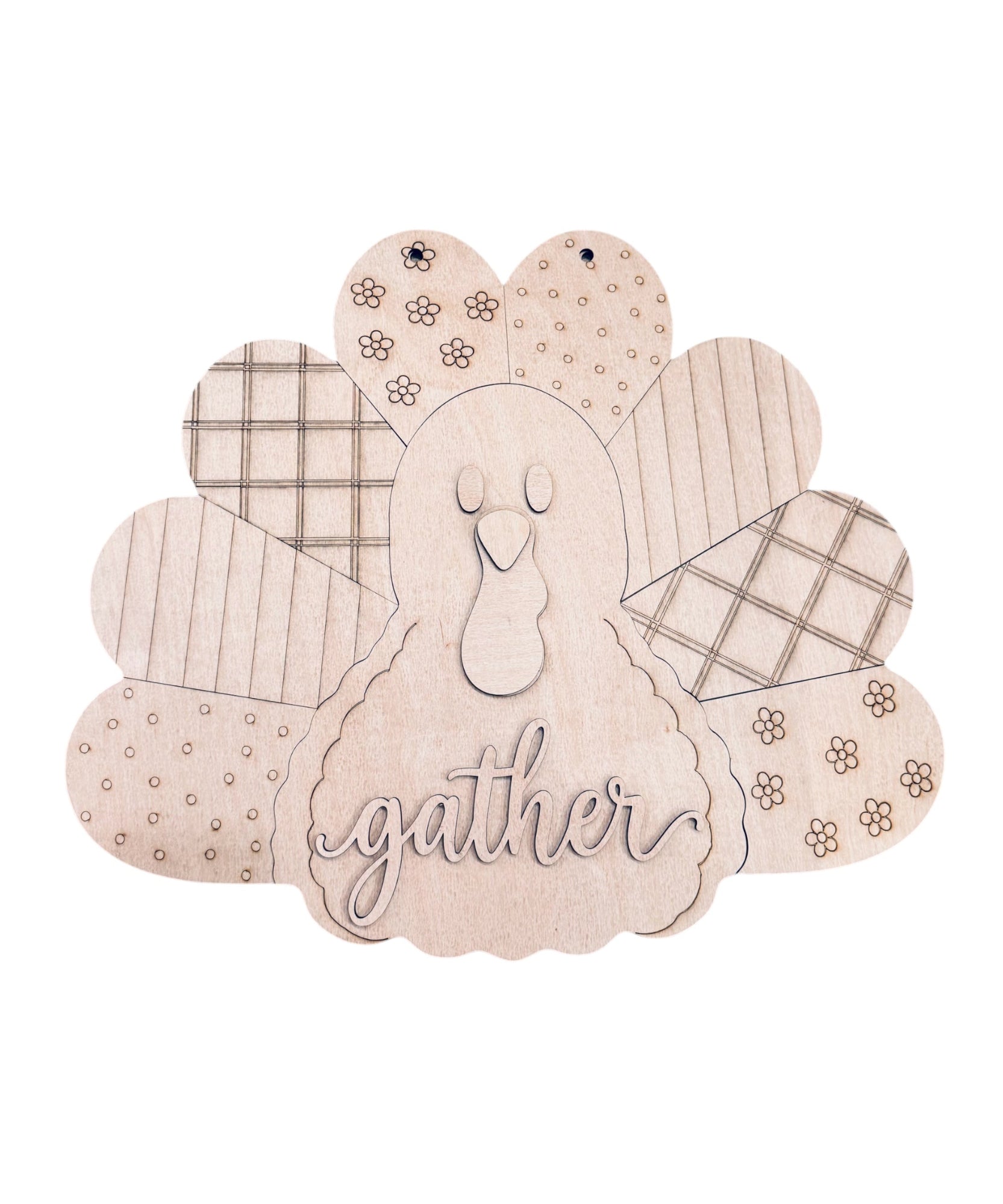 A wooden Thanksgiving decorative sign shaped like a turkey, featuring engraved patterns on the feathers and the word 'gather' in script on the body, shown on a plain white background.