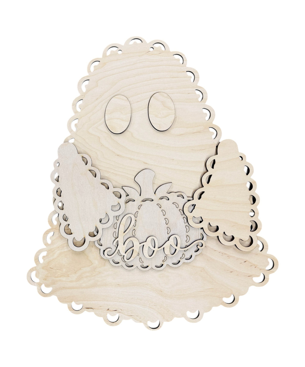Unpainted wooden ghost-shaped craft kit with laser-cut scalloped edges, oval eyes, wings, and a central pumpkin with the word 'goof' cut out in the middle, shown on a white background.