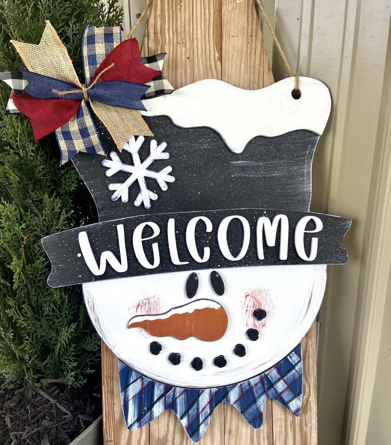 Welcome snowman hand-painted laser cut wood door hanger with top hat, snowflake, carrot nose, plaid scarf and patriotic bow, 23 inch