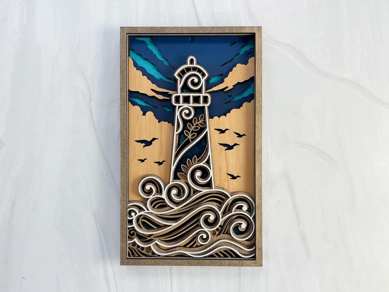 3D layered wood lighthouse wall art with ocean waves and birds