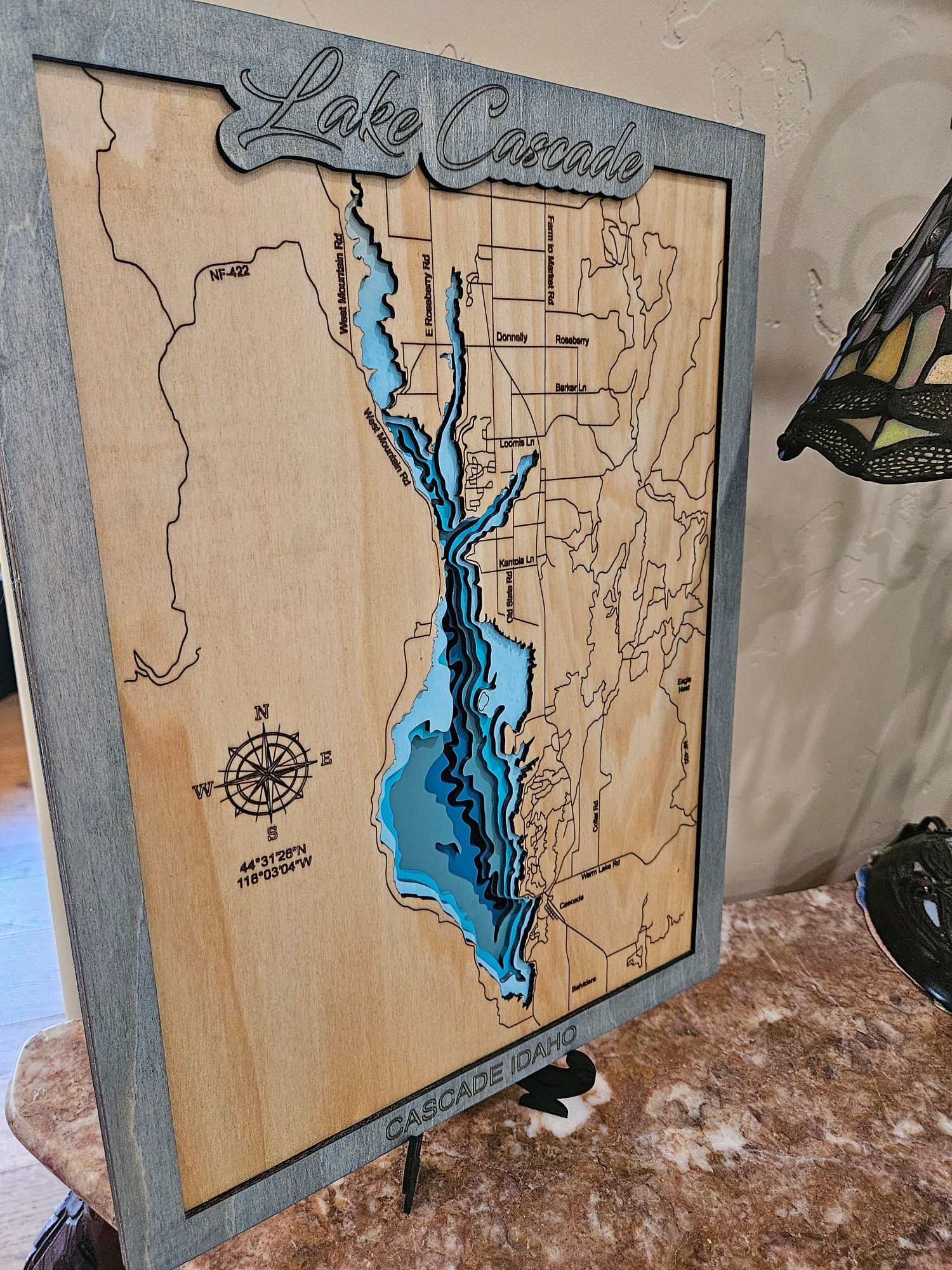 Custom laser cut wood map art close-up showing wood layer detail