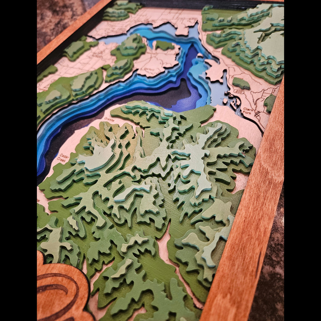 Topographic map with a river illustration on a wooden frame