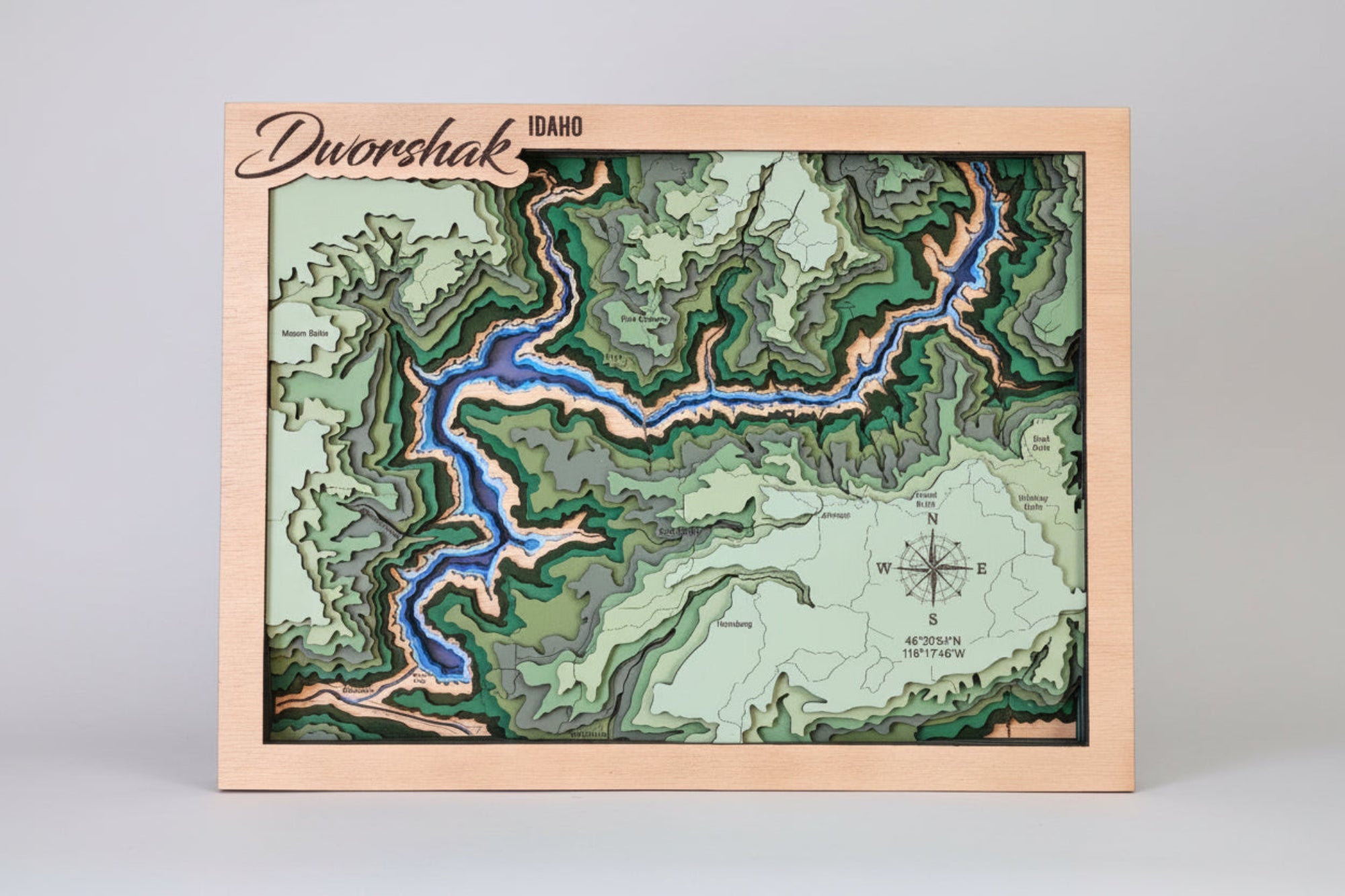 Topographic map with river illustration on a wooden board