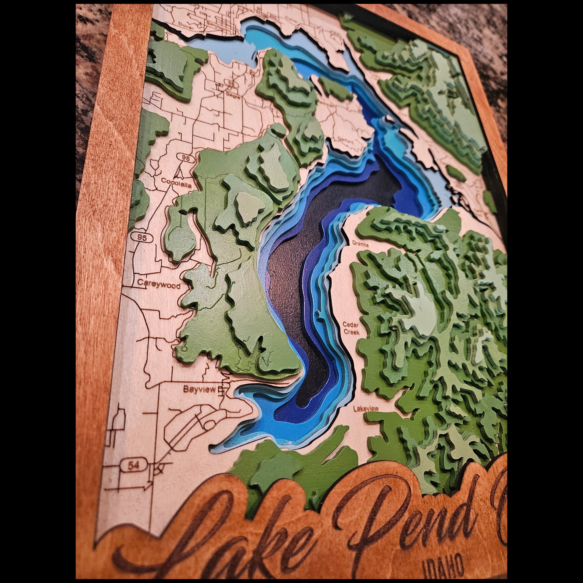 Wooden topographic map of a lake with 'Lake Penn' branding.